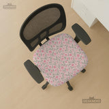 Pink chair cover with a tulip floral print shown as a desk chair slipcover, with armrest covers and size options.
