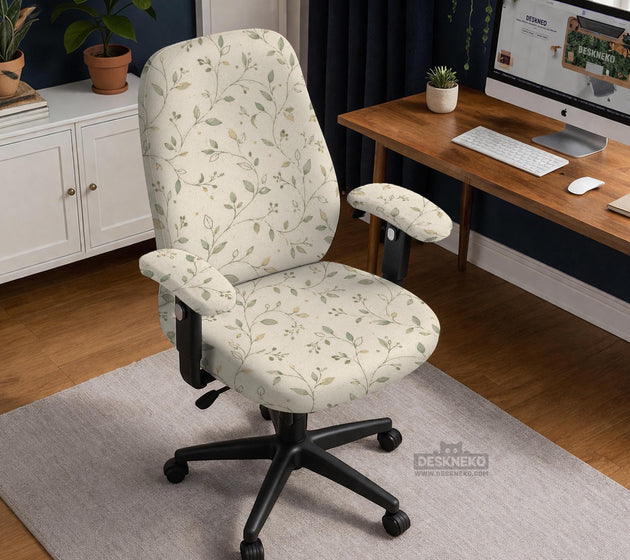 Cream floral chair covers with muted sage leaves and fine vine details on an ivory background, shown as multiple slipcover options for chair backs, seats, and armrests.