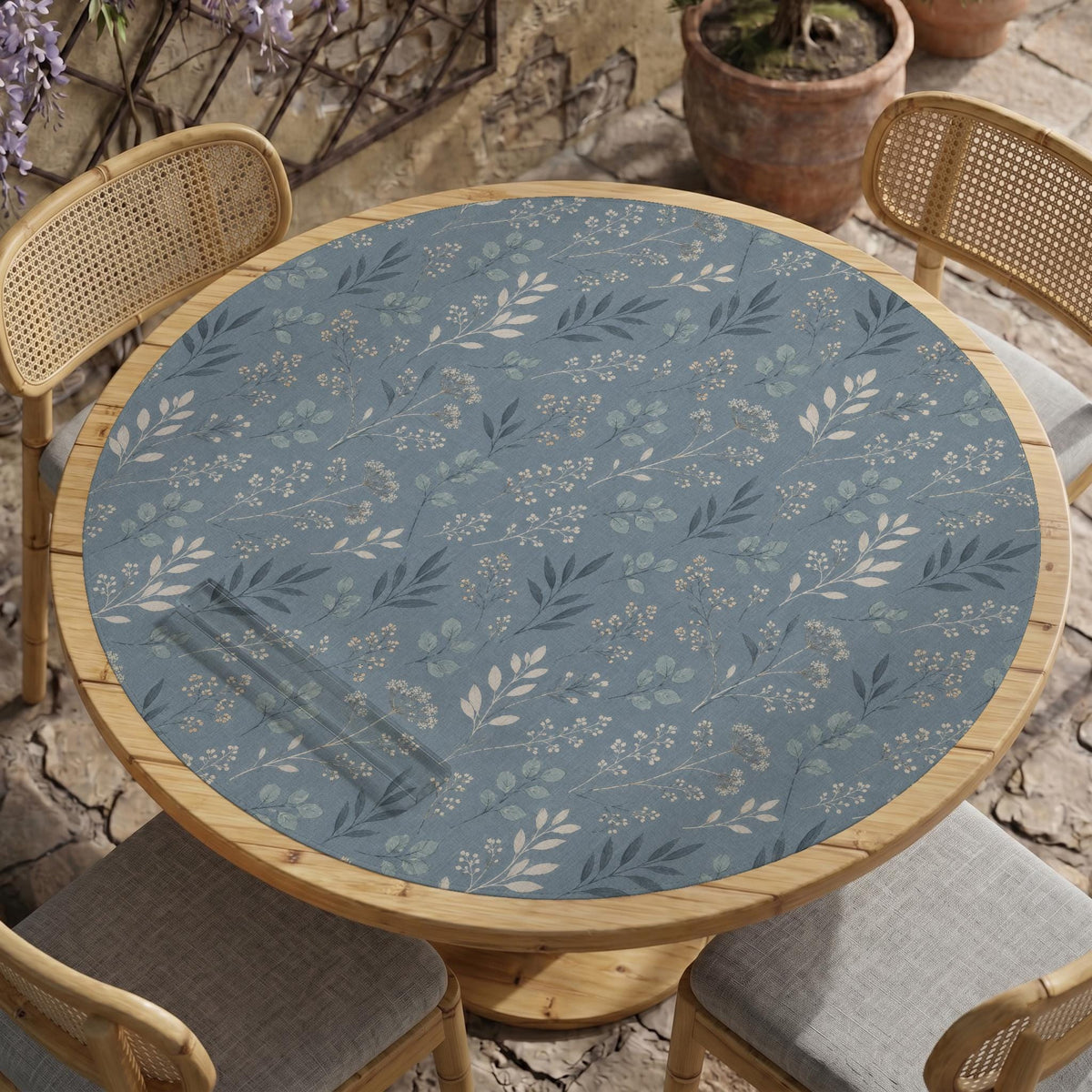 Blue mahjong mat with a dusty linen-look background and small leafy botanical stems in a floral pattern.