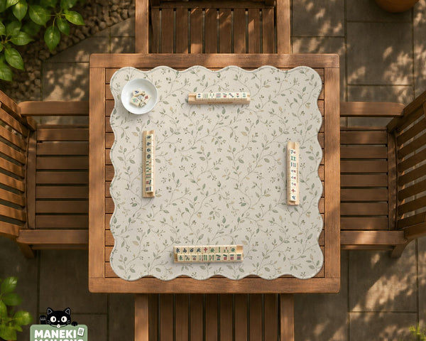 Sage green mahjong mat with vine and botanical artwork in cream neutral tones, shown in a cottagecore style with a tablecloth-style format.