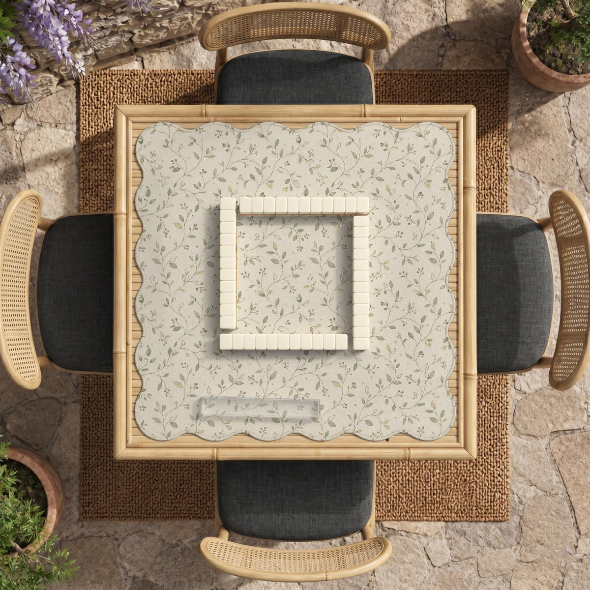 Cream square mahjong mat with a sage vine and leaf botanical pattern and scalloped edges.