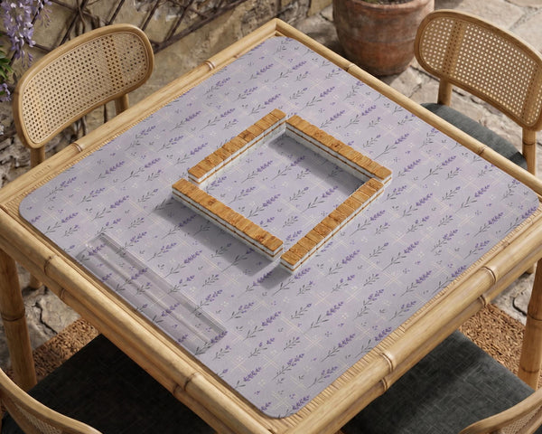 Lavender mahjong mat with a pale purple background, small botanical sprigs, and fine grid lines.