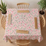 A pink mahjong mat with tulip flowers, sage leaves, and a light pastel background.