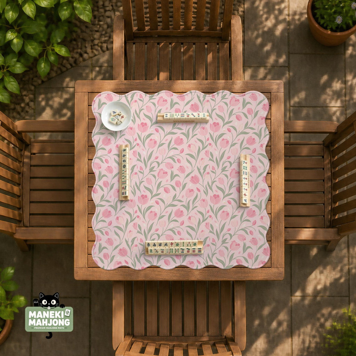 Pink mahjong mat with a botanical tulip floral pattern in blush tones, shown in a tablecloth-style square layout.