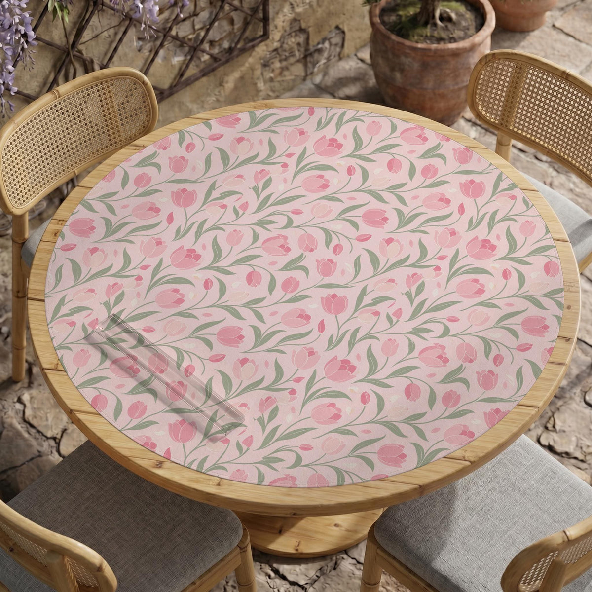 Pink mahjong mat with a tulip floral pattern in blush and sage tones and a scalloped edge.
