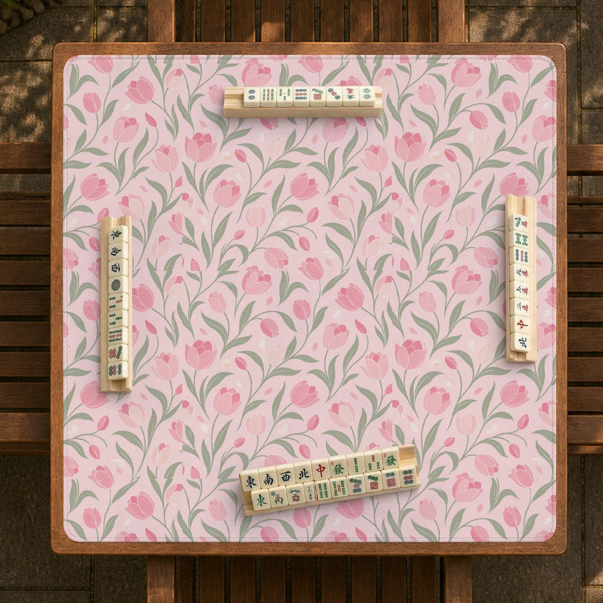 Pink mahjong mat with a tulip floral pattern in blush and sage tones and a scalloped edge.