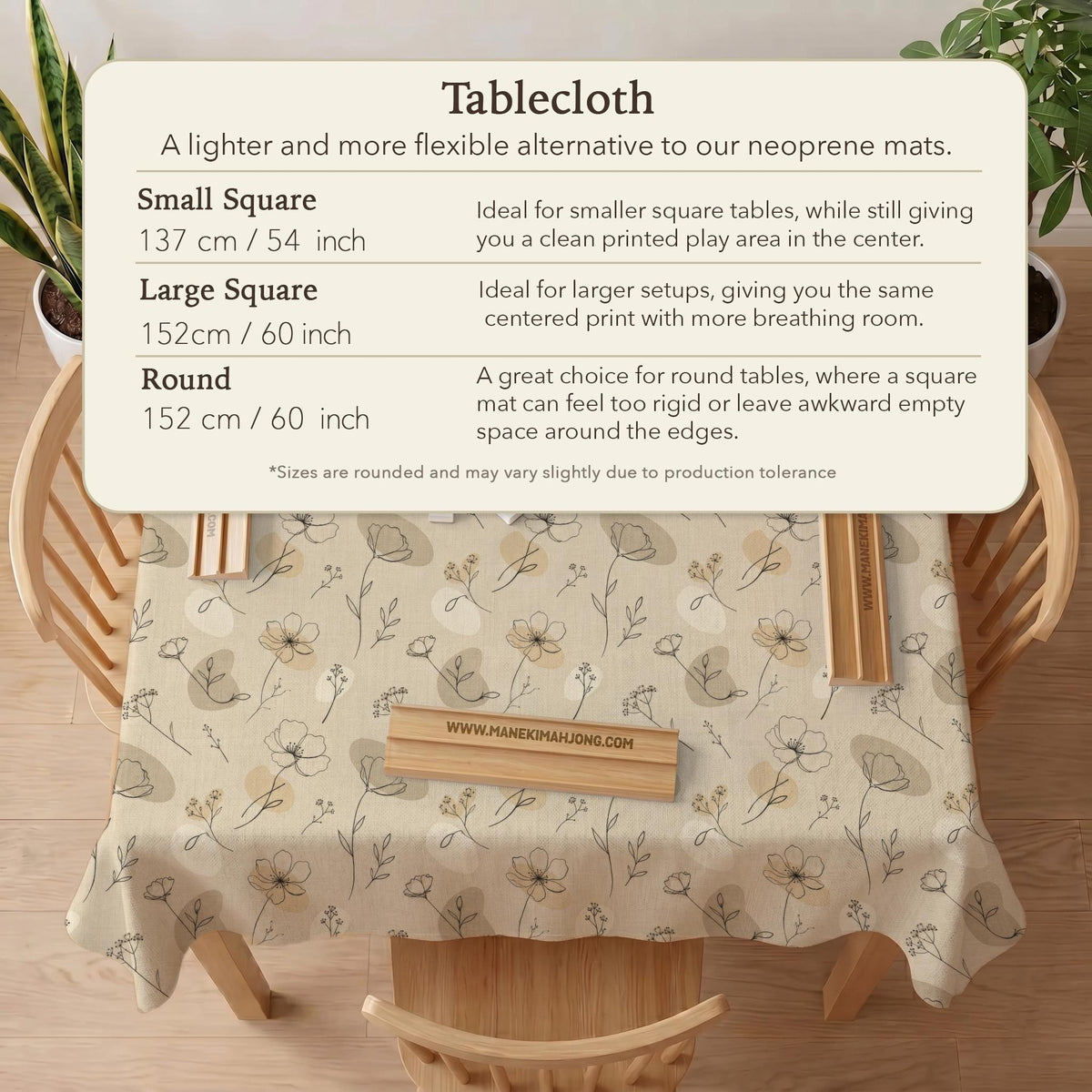Neutral floral mahjong mat with delicate botanical line art and a scalloped edge on a cream background.