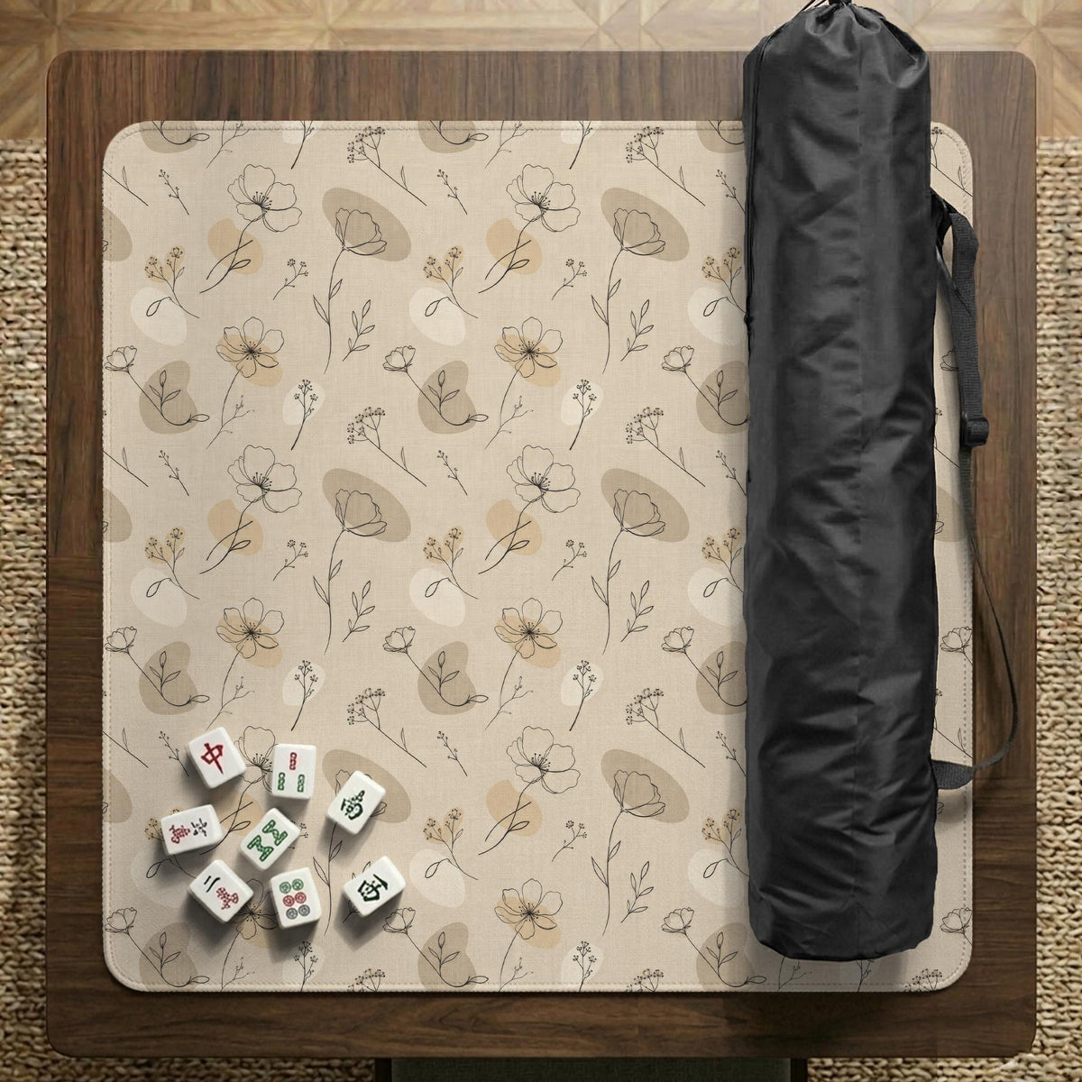 Neutral floral mahjong mat with delicate botanical line art and a scalloped edge on a cream background.