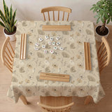 Neutral floral mahjong mat with delicate botanical line art and a scalloped edge on a cream background.