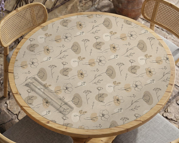 Neutral floral mahjong mat with delicate botanical line art and a scalloped edge on a cream background.