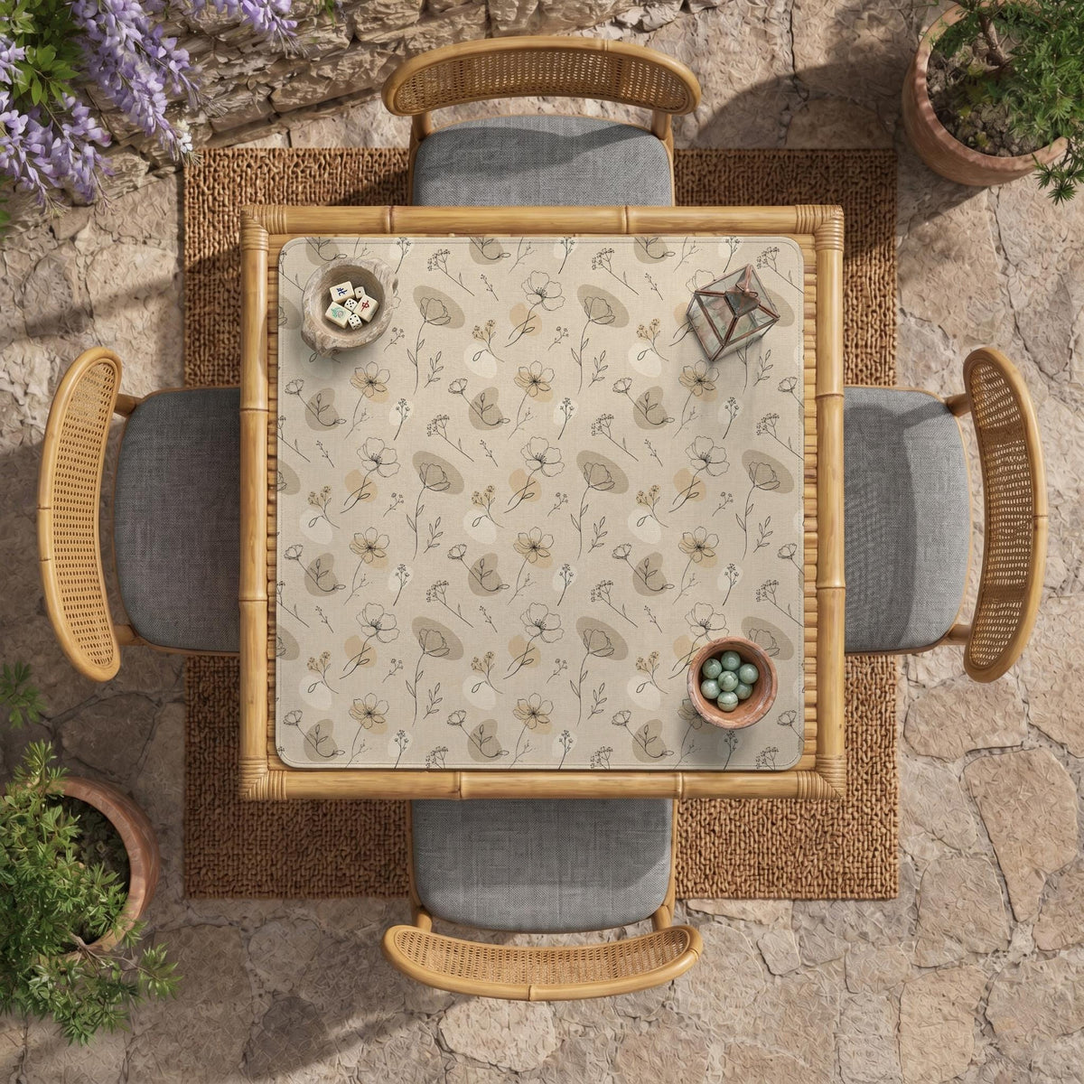 Neutral floral mahjong mat with delicate botanical line art and a scalloped edge on a cream background.