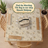 Neutral floral mahjong mat with delicate botanical line art and a scalloped edge on a cream background.