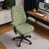 Sage green chair cover with a small floral print shown on a desk chair with a high back.