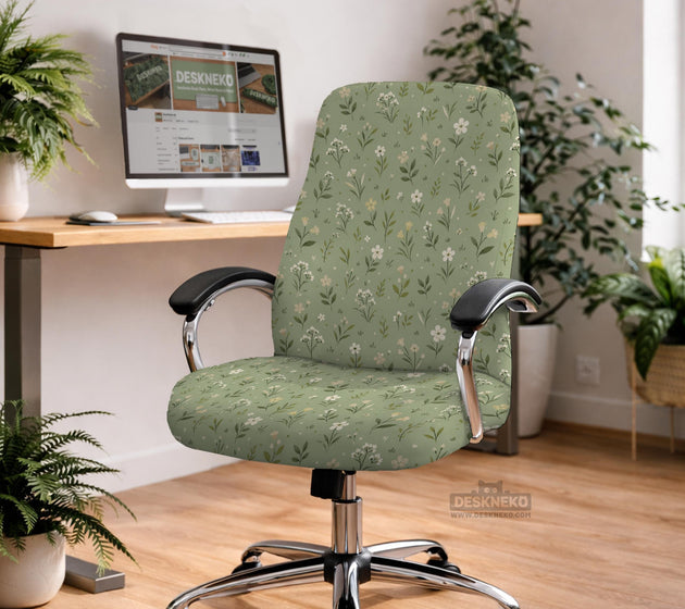Sage green chair cover with a small floral print shown on a desk chair with a high back.