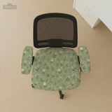 Sage green chair cover with a small floral print shown on a desk chair with a high back.