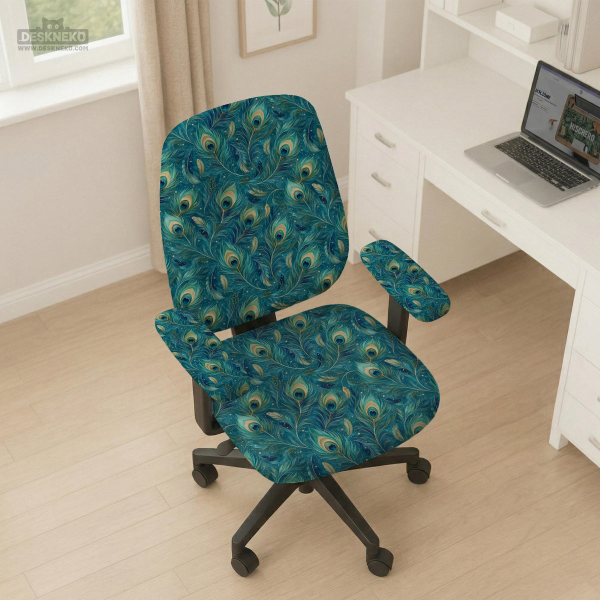 A blue green chair cover with a peacock feather design shown on an office chair with armrests.