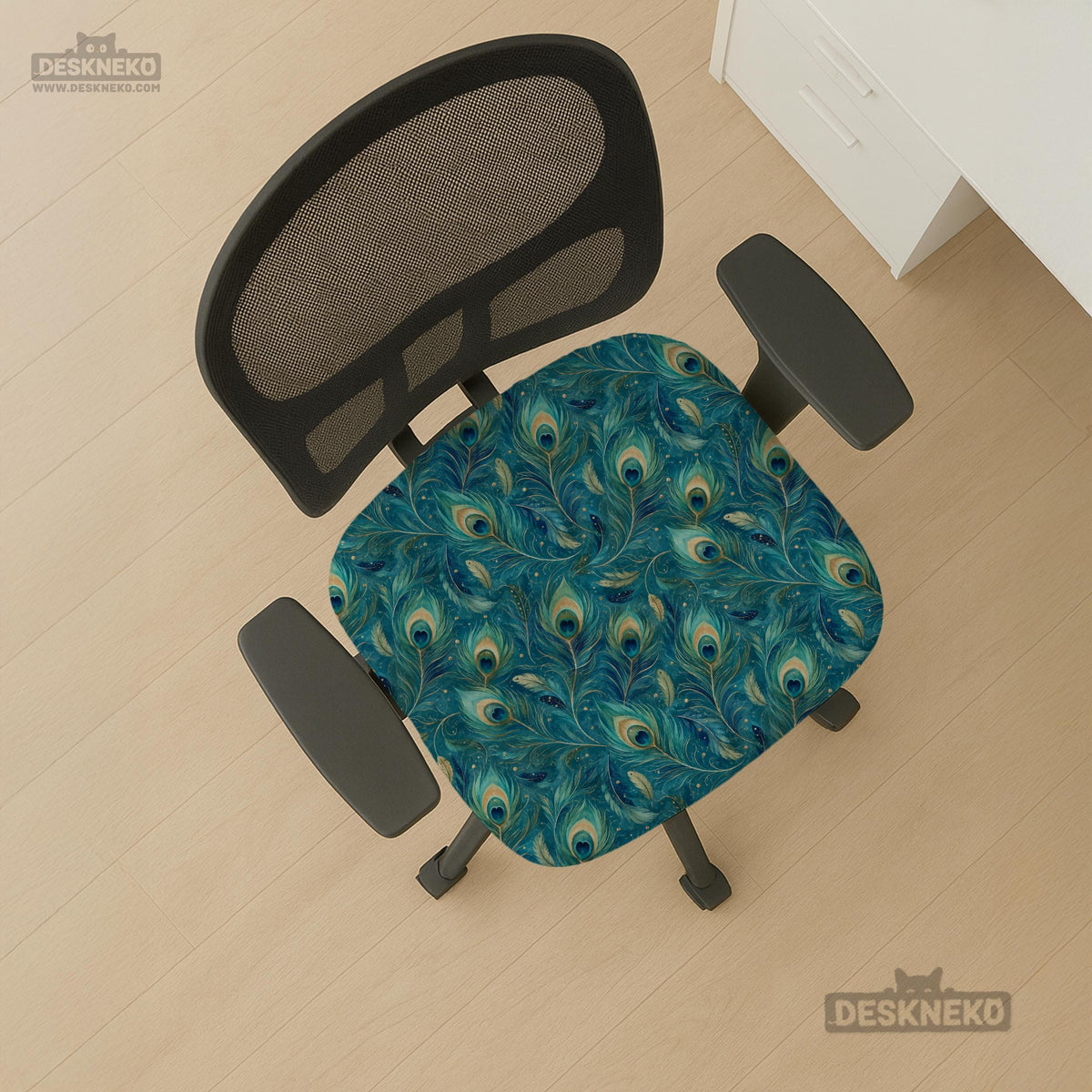 Blue green chair cover with a peacock feather pattern shown on an office chair, with fitted stretch fabric and armrest coverage visible in the listing image.