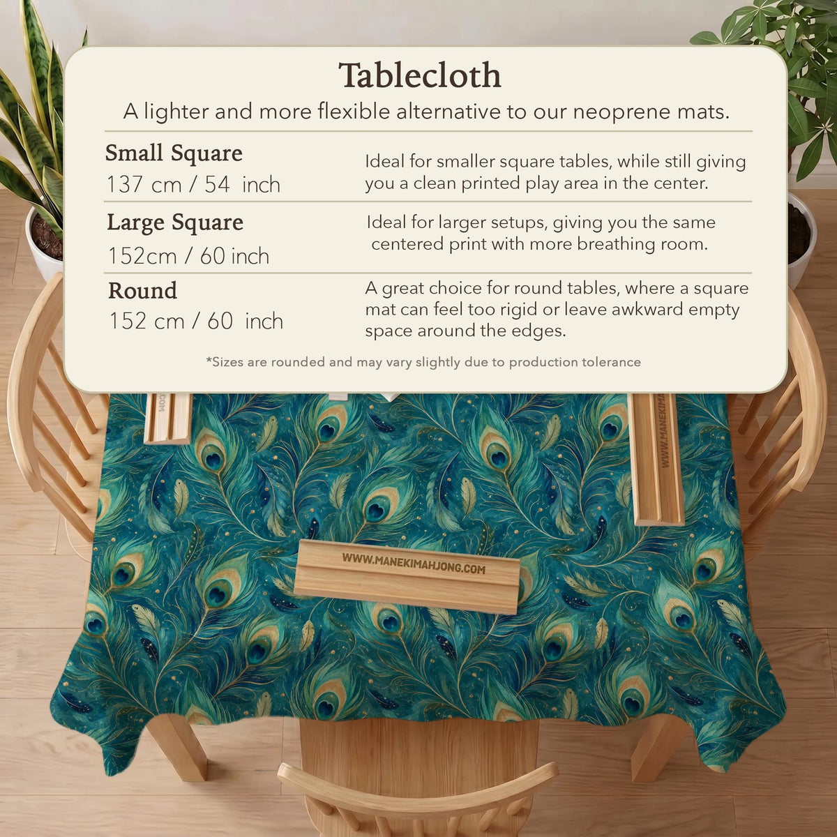 A teal mahjong mat with a peacock feather pattern and scalloped edges.