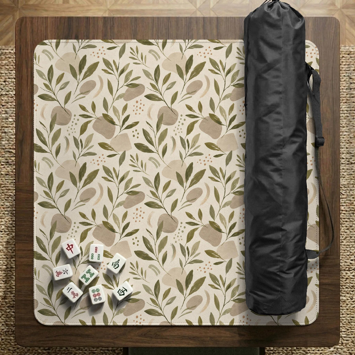 Green botanical mahjong mat with sage leaf and floral design and a scalloped edge.
