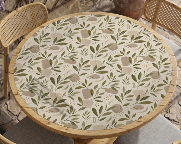 Green botanical mahjong mat with sage leaf and floral design and a scalloped edge.