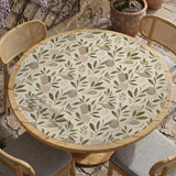 Green botanical mahjong mat with sage leaf and floral design and a scalloped edge.