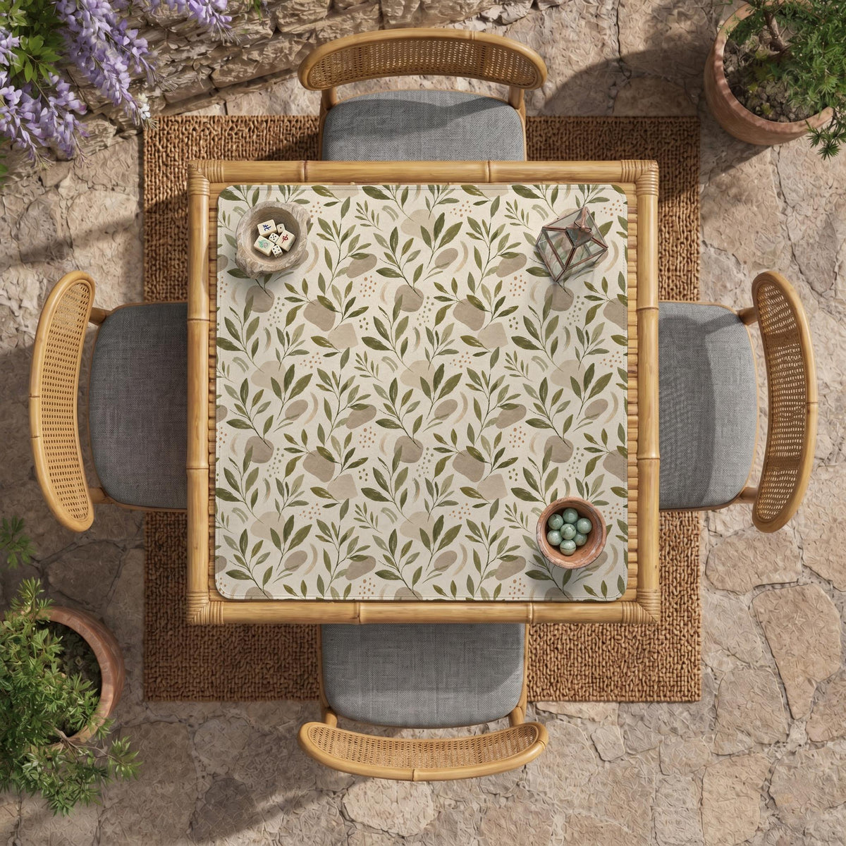 Green botanical mahjong mat with sage leaf and floral design and a scalloped edge.
