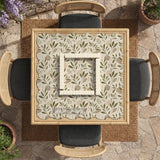 Green botanical mahjong mat with sage leaf and floral design and a scalloped edge.