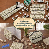 Green botanical mahjong mat with sage leaf and floral design and a scalloped edge.