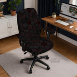 Black chair cover with a dark red geometric pattern shown on an office chair, with a fitted stretch look.