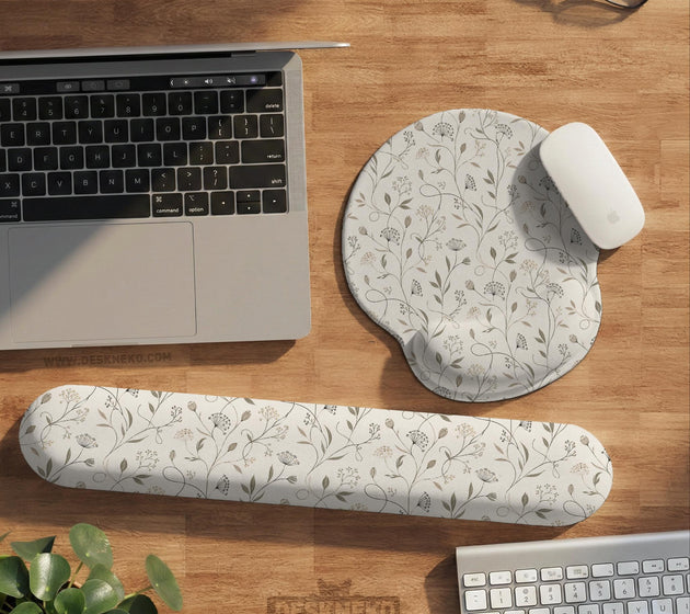 Ivory mouse pad and keyboard wrist rest with delicate wildflower line art in sage, taupe, and cream tones.