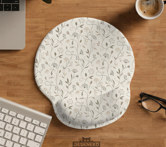 Ivory mouse pad and keyboard wrist rest with delicate wildflower line art in sage, taupe, and cream tones.
