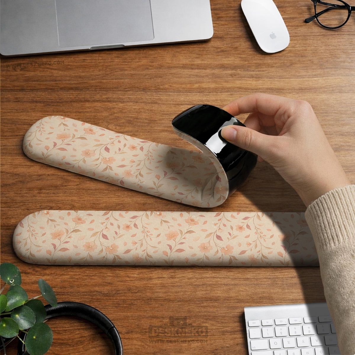 Blush pink floral mouse pad with wrist rest options, shown with peach blossoms, muted leaves, and a warm cream background.