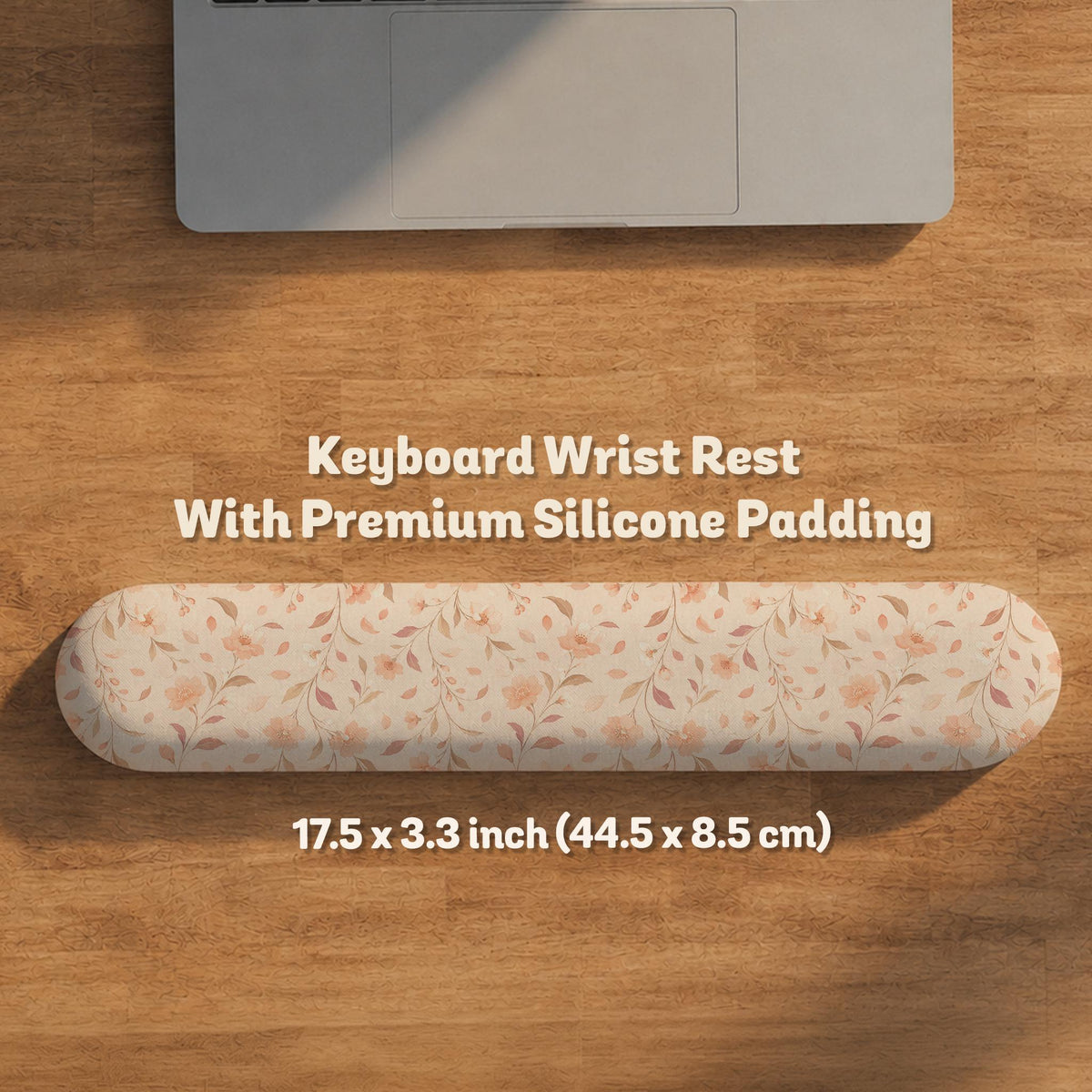 Blush pink floral mouse pad with wrist rest options, shown with peach blossoms, muted leaves, and a warm cream background.