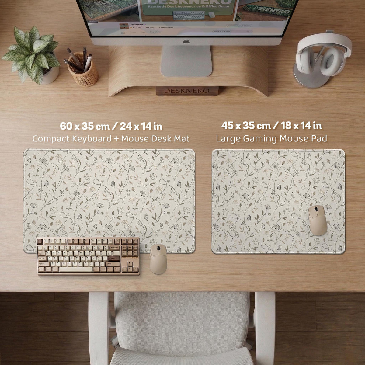 Ivory desk mat with delicate sage and taupe vine and floral artwork on a neutral background.