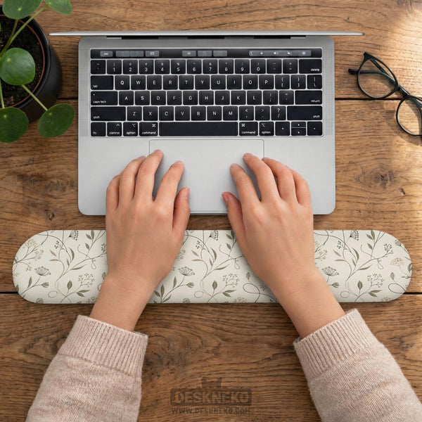Ivory mouse pad and keyboard wrist rest with delicate wildflower line art in sage, taupe, and cream tones.