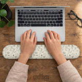 Ivory mouse pad and keyboard wrist rest with delicate wildflower line art in sage, taupe, and cream tones.