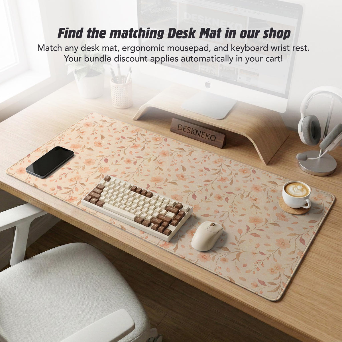 Blush pink floral mouse pad with wrist rest options, shown with peach blossoms, muted leaves, and a warm cream background.