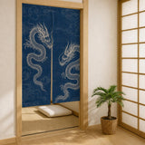 Angled view of the indigo white dragon noren beside a shoji screen, showing natural panel drape.