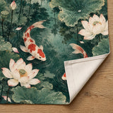 Japanese-style doorway curtain with vermilion and ivory koi fish swimming through a jade lotus pond with broad green leaves, pale blossoms, and ripple details.