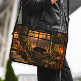 Illustration of a black cat beside stacked books and leafy plants in forest green, brown, and amber tones on a laptop sleeve and shoulder bag design.