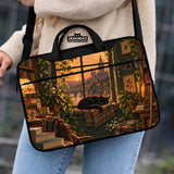 Illustration of a black cat beside stacked books and leafy plants in forest green, brown, and amber tones on a laptop sleeve and shoulder bag design.