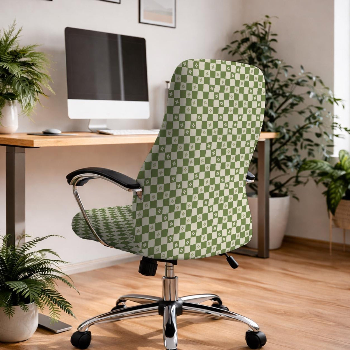 An office chair cover with a matcha green and ivory checker pattern and small four-petal flowers.