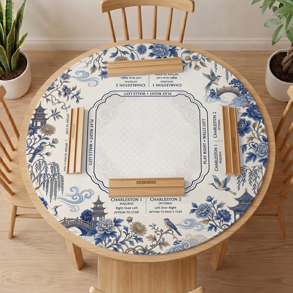 Square ivory mahjong mat with blue cranes, pagodas, flowers, and a blue border around the playing area.