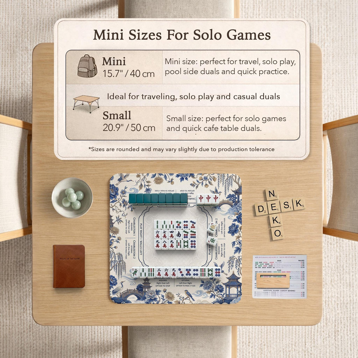Square ivory mahjong mat with blue cranes, pagodas, flowers, and a blue border around the playing area.