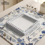 Square ivory mahjong mat with blue cranes, pagodas, flowers, and a blue border around the playing area.