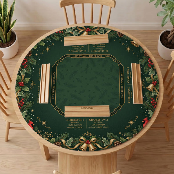 Green mahjong mat with red cardinals, holly berries, cream poinsettias, and gold seasonal details around a printed Charleston guide.