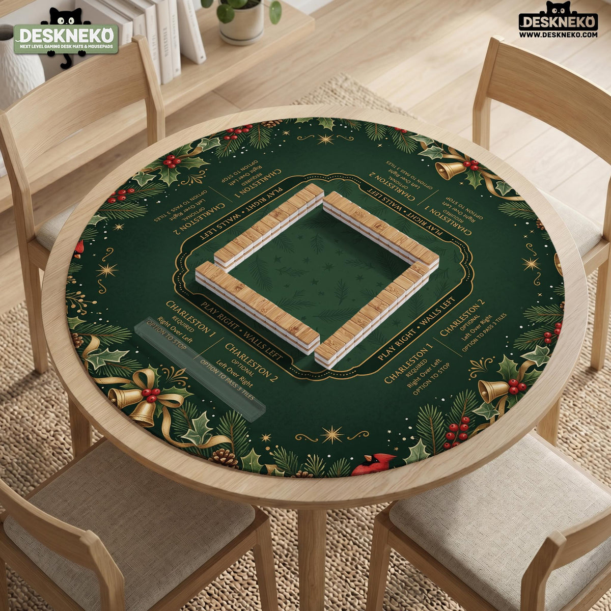 Green mahjong mat with red cardinals, holly berries, cream poinsettias, and gold seasonal details around a printed Charleston guide.
