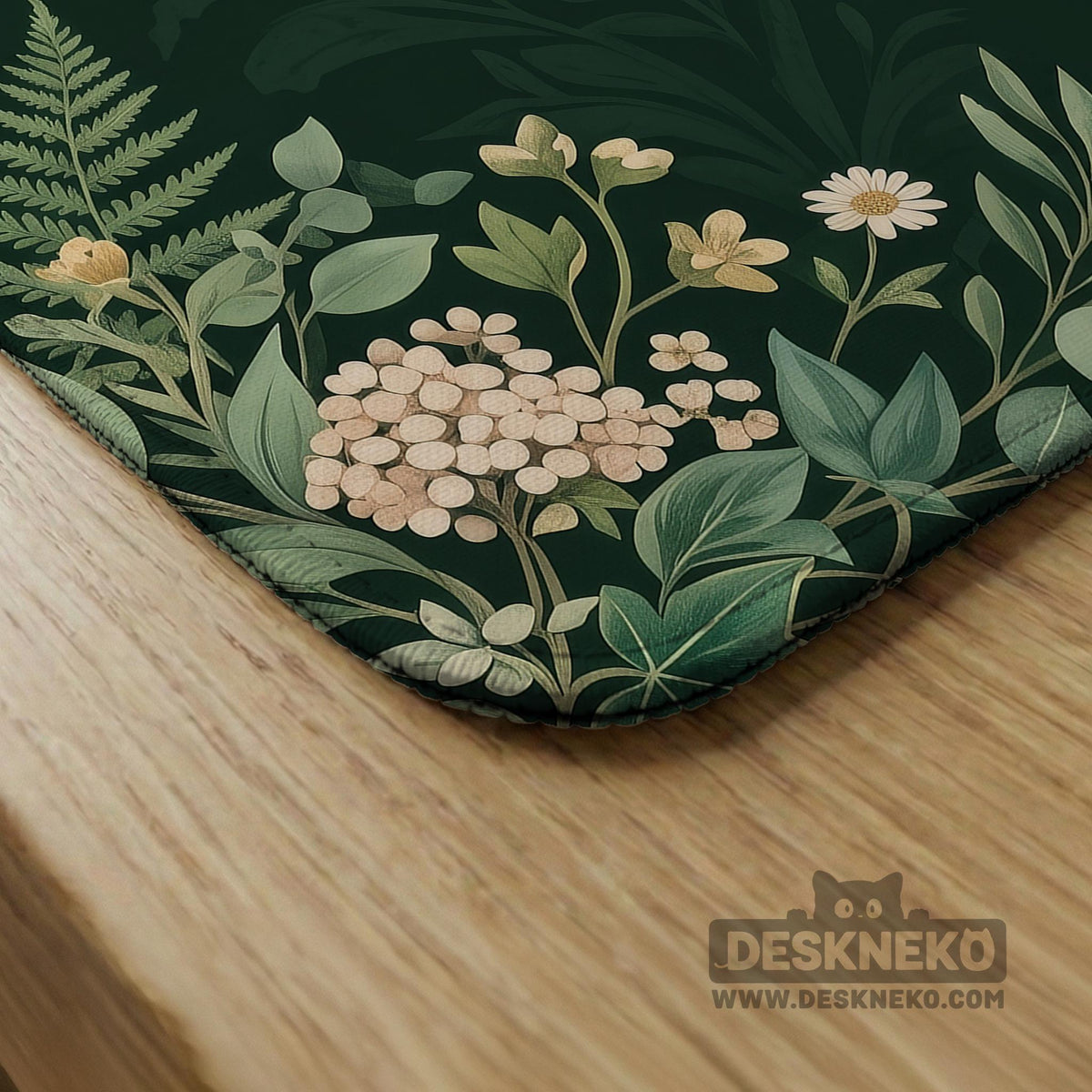 Square mahjong mat with a forest green botanical design, fern leaves, small cream flowers, and a printed Charleston guide around the center area.