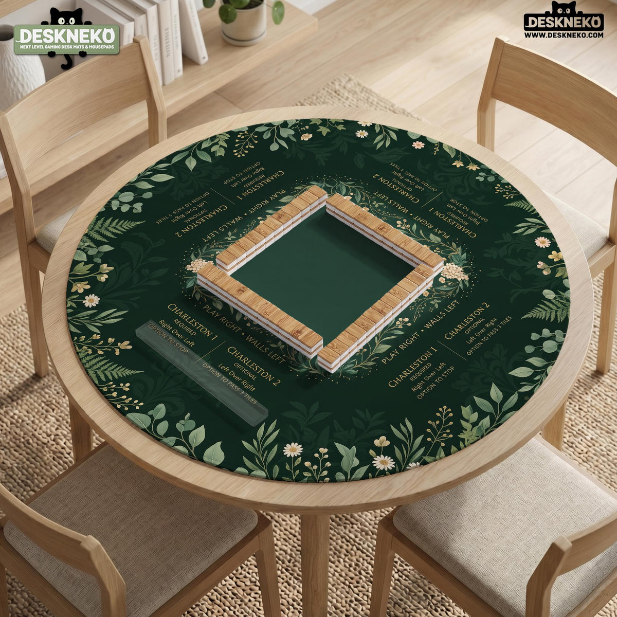 Square mahjong mat with a forest green botanical design, fern leaves, small cream flowers, and a printed Charleston guide around the center area.