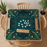 American mahjong mat with a deep teal-green background, peacocks, small cream flowers, leafy branches, and printed play-direction and Charleston reminders.